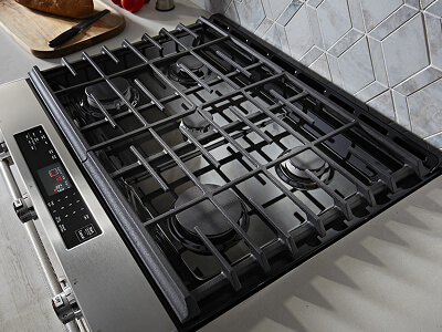 A top view of a stainless steel slide-in range