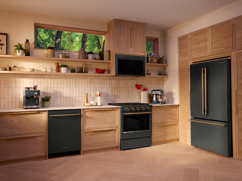 A modern kitchen featuring a KitchenAid® suite of appliances