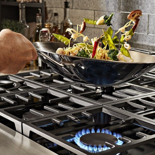Vegetables being stir fried in a wok