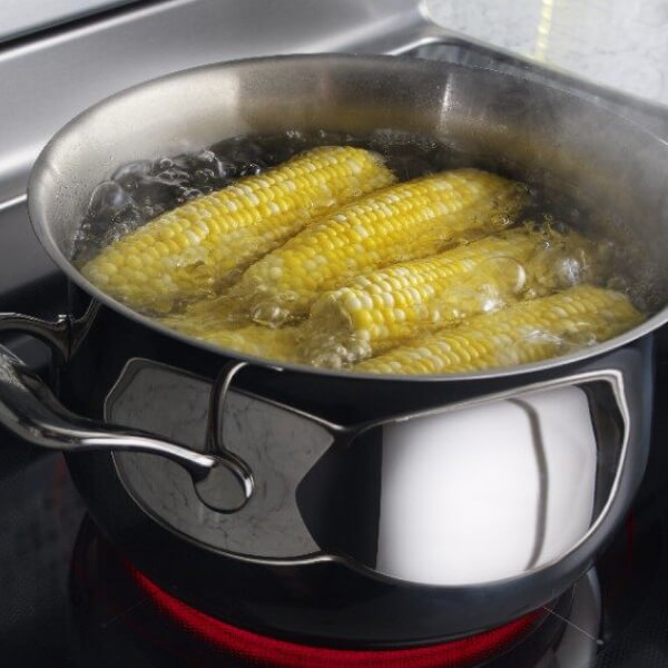 Corn boiling in a pot of water