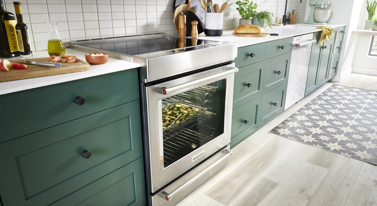 KitchenAid® slide-in electric range with vegetables baking inside the oven KitchenAid® slide-in electric range with vegetables baking inside the oven