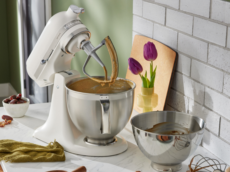 A white stand mixer with an attachment A white stand mixer with an attachment