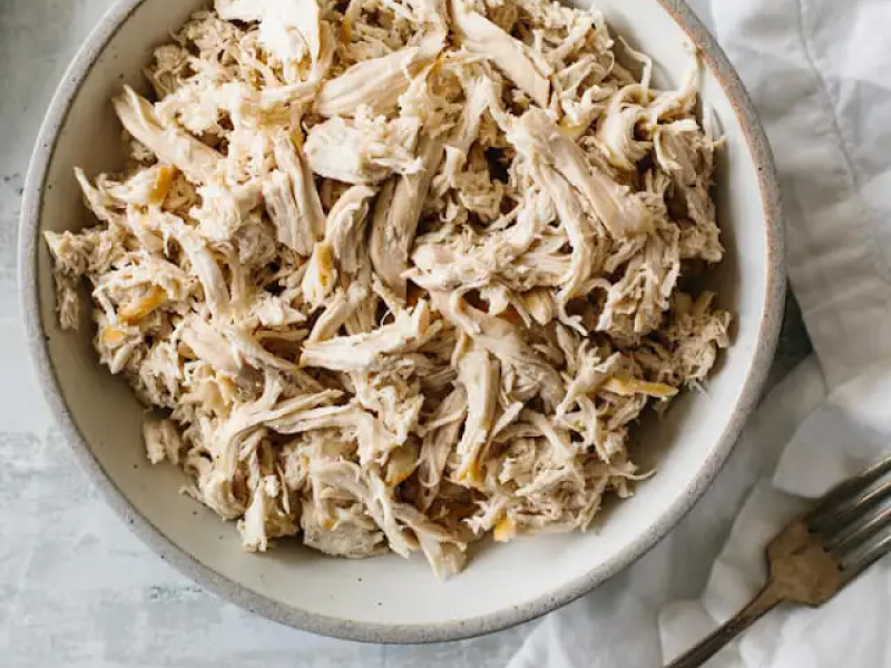 A woman adding spices to a loaf of bread dough that’s ready to go into the oven. A woman adding spices to a loaf of bread dough that’s ready to go into the oven.