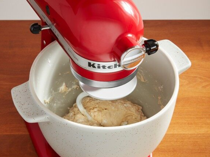 Red KitchenAid® stand mixer kneading dough