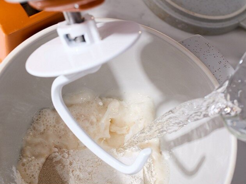 Dough hook in a mixing bowl of dough