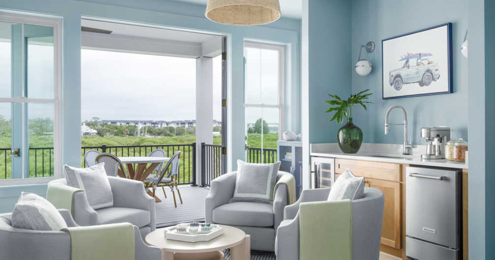 Light and airy living room with doors leading to a balcony