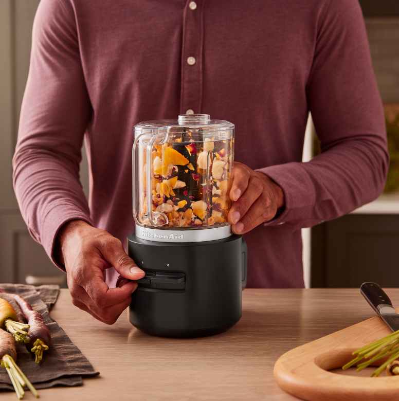 A person using a KitchenAid Go™ Cordless Food Chopper.