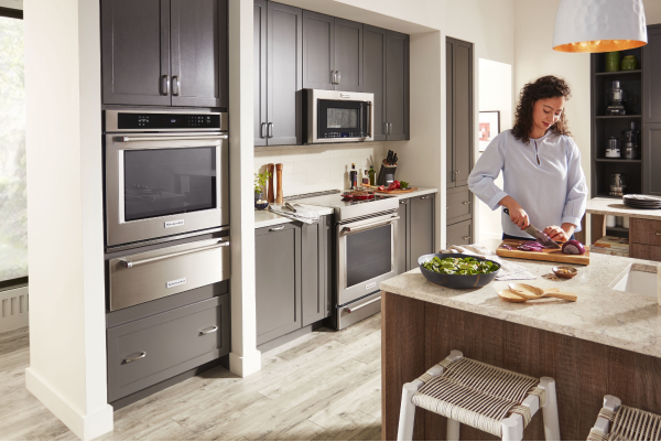 Person preparing food at a kitchen island