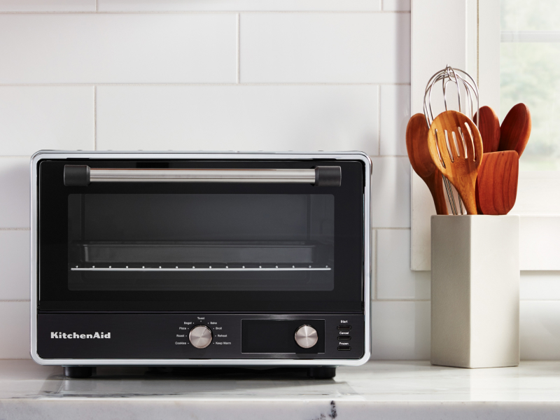 A KitchenAid® countertop oven with air fry on a modern kitchen counter.  A KitchenAid® countertop oven with air fry on a modern kitchen counter.