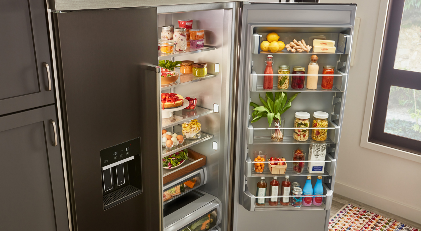 An open refrigerator door where food items are being stored