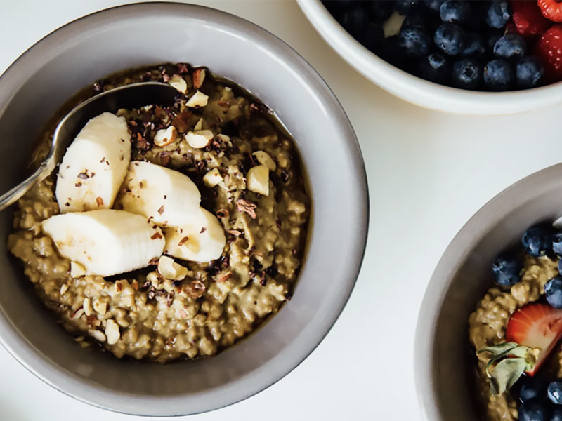 Homemade oatmeal with various fruit toppings and chopped nuts Homemade oatmeal with various fruit toppings and chopped nuts