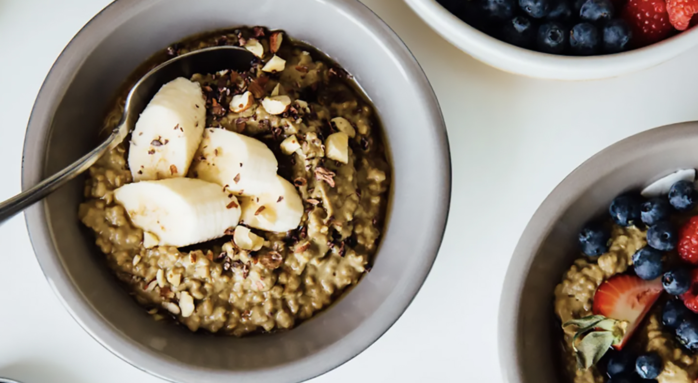 Homemade oatmeal with various fruit toppings and chopped nuts Homemade oatmeal with various fruit toppings and chopped nuts