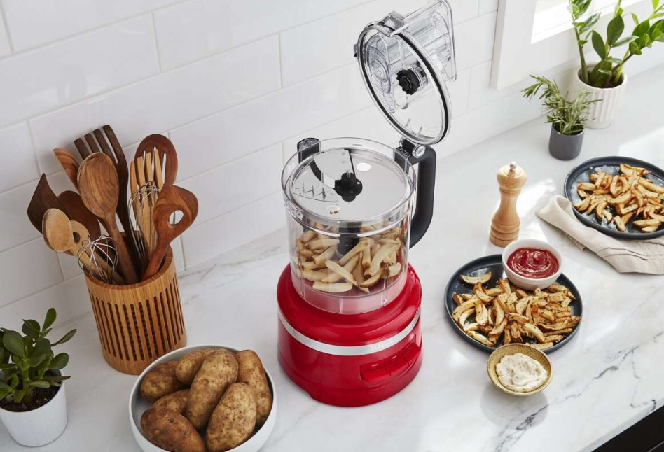 KitchenAid® Food Processor with sliced potatoes on a counter  KitchenAid® Food Processor with sliced potatoes on a counter