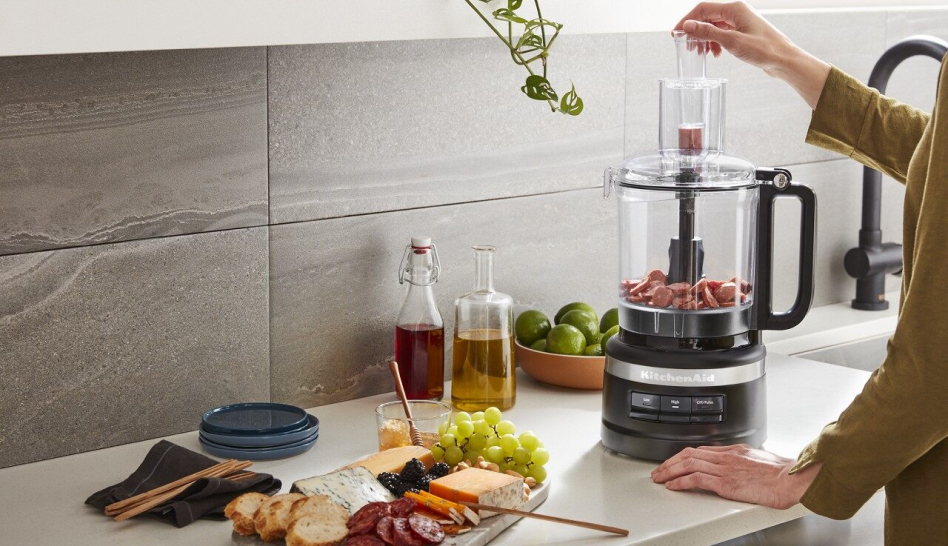 Woman using a KitchenAid® Food Processor Woman using a KitchenAid® Food Processor