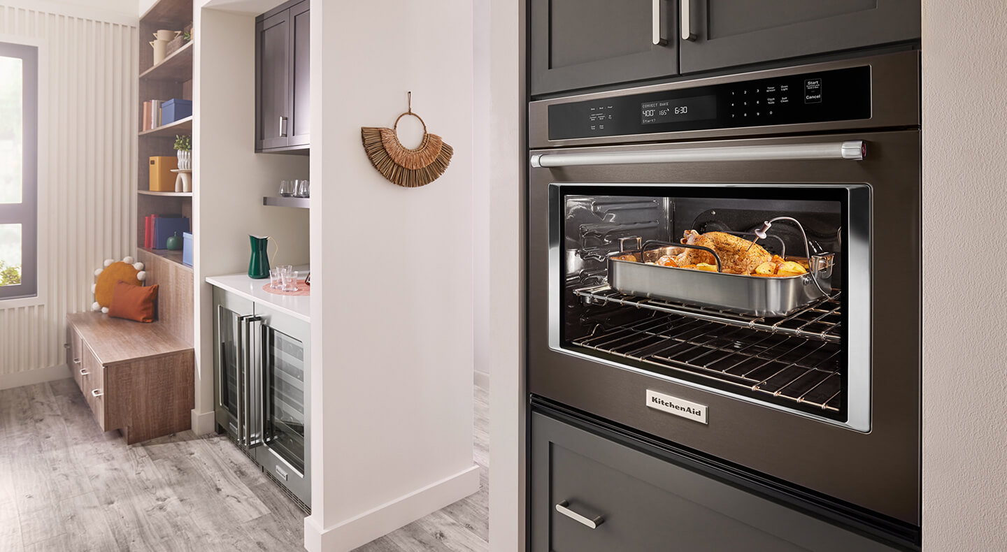 KitchenAid® combination oven with the oven light on