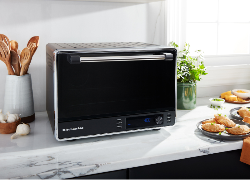 A KitchenAid® countertop oven with an air fry basket A KitchenAid® countertop oven with an air fry basket