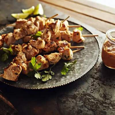 Thai chicken skewers on a plate
