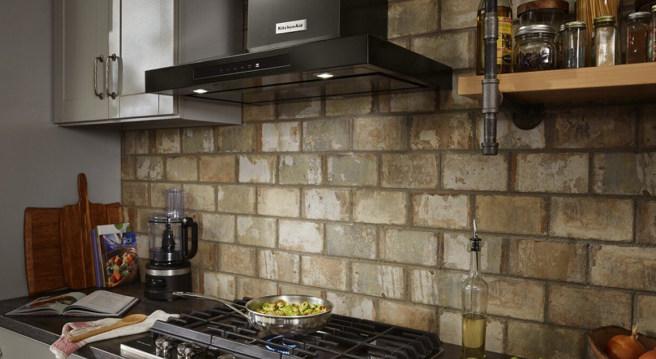 KitchenAid® range hood in kitchen with brick backsplash KitchenAid® range hood in kitchen with brick backsplash