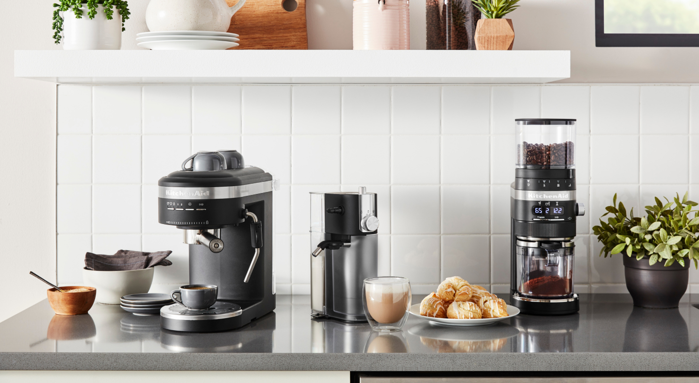 Coffee-making appliances from KitchenAid brand on counter with scones Coffee-making appliances from KitchenAid brand on counter with scones