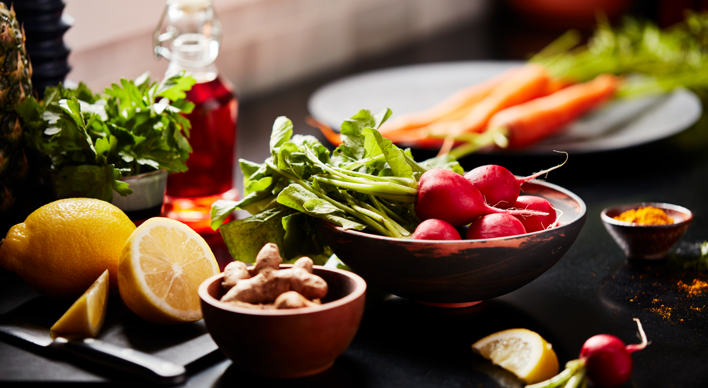 Lemons, carrots, radishes and lettuce on a countertop. Lemons, carrots, radishes and lettuce on a countertop.