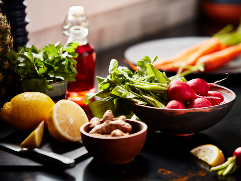 Lemons, carrots, radishes and lettuce on a countertop. Lemons, carrots, radishes and lettuce on a countertop.