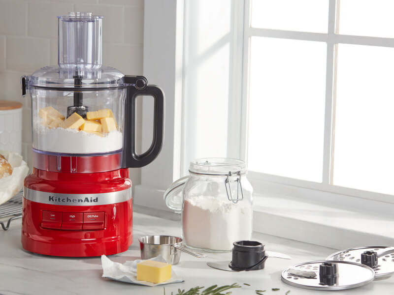KitchenAid® food processor with bread ingredients on countertop