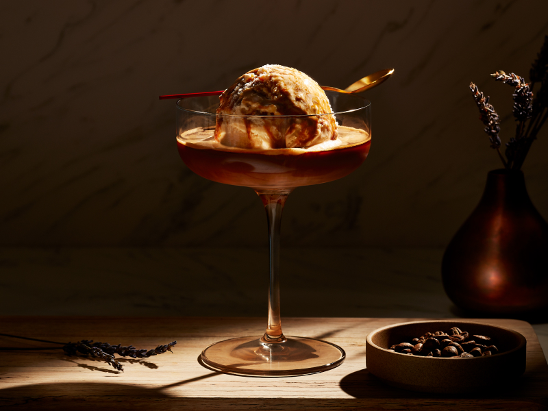 An affogato in a glass serving dish