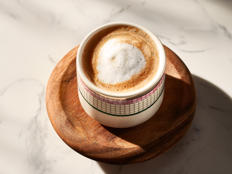An espresso con panna in an ornate coffee cup