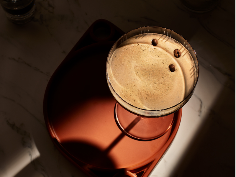 Birds-eye view of an espresso martini on a serving tray