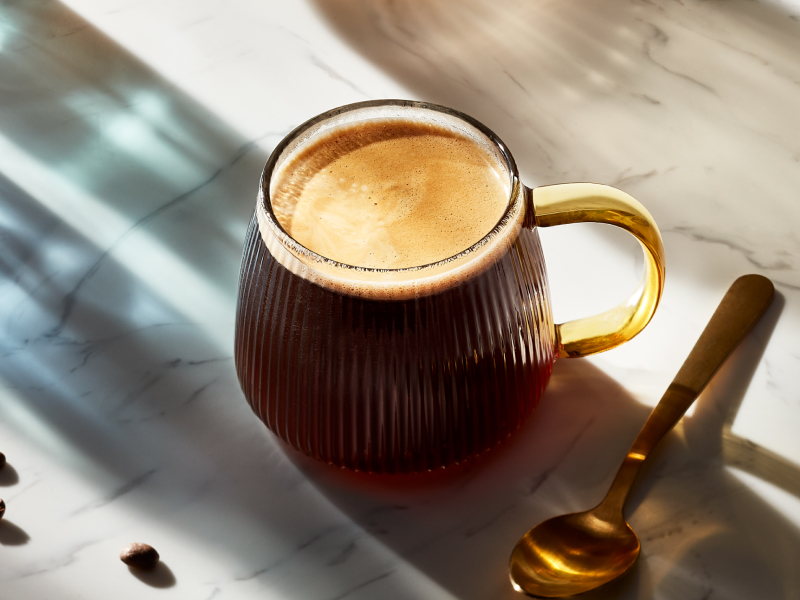 Americano in coffee cup on granite countertop