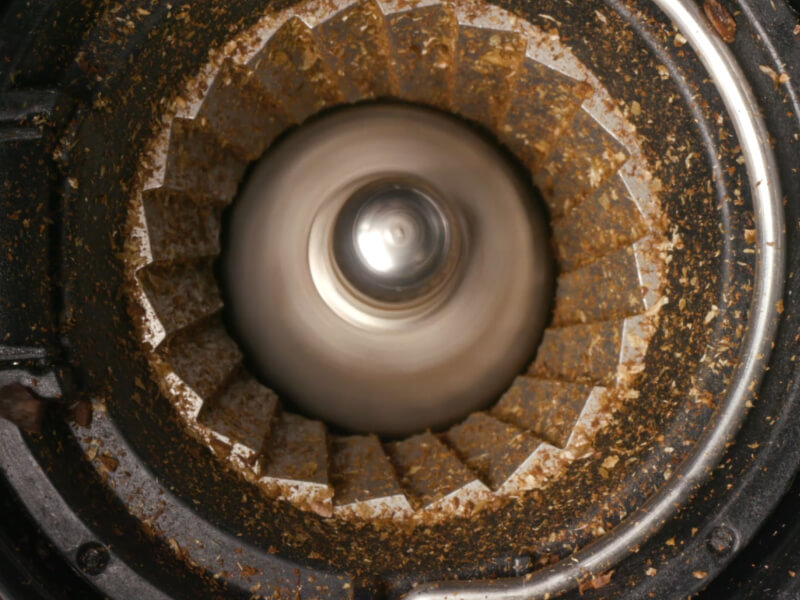 Closeup image of a coffee bean grinder