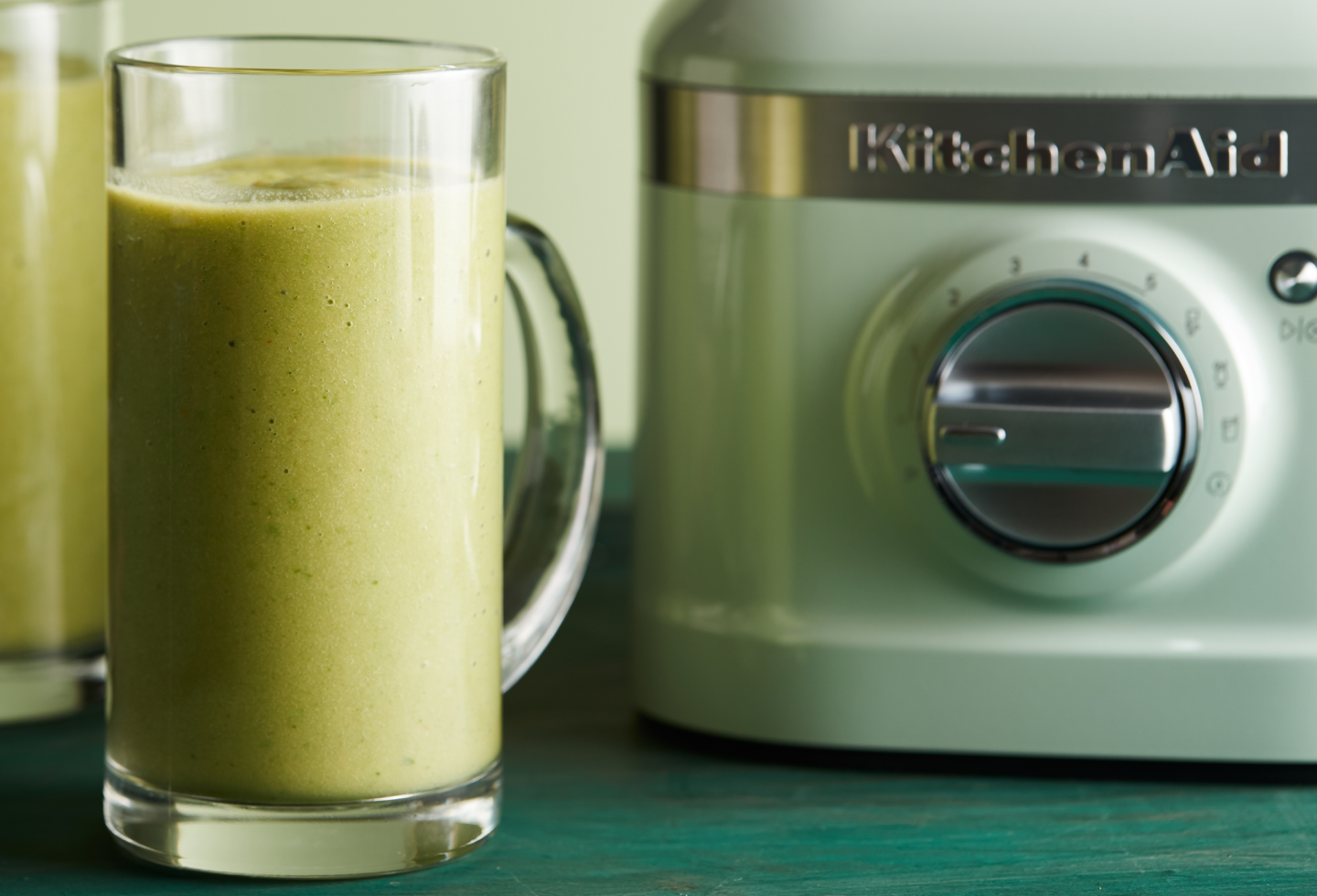 Pineapple juice next to a KitchenAid® blender Pineapple juice next to a KitchenAid® blender