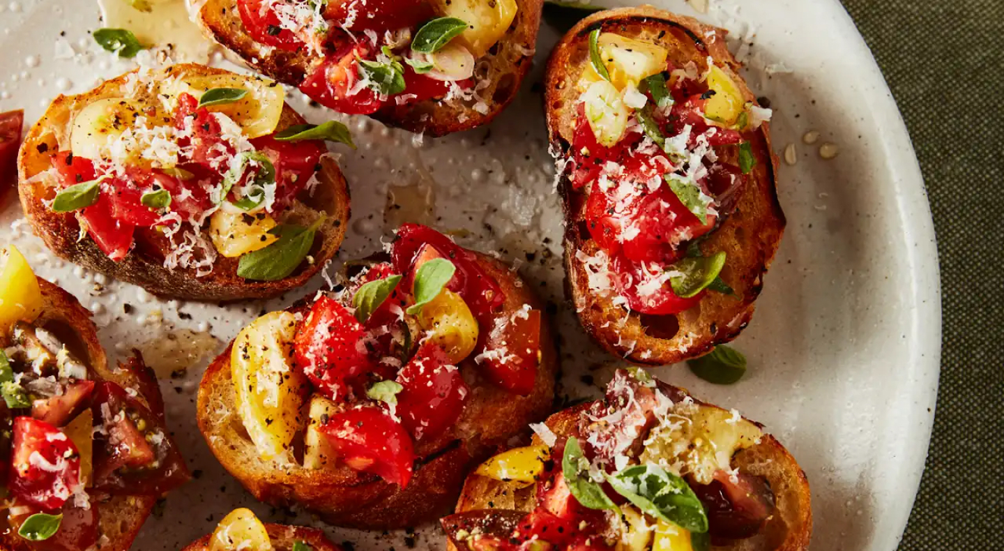Fresh bruschetta garnished with basil. Fresh bruschetta garnished with basil.