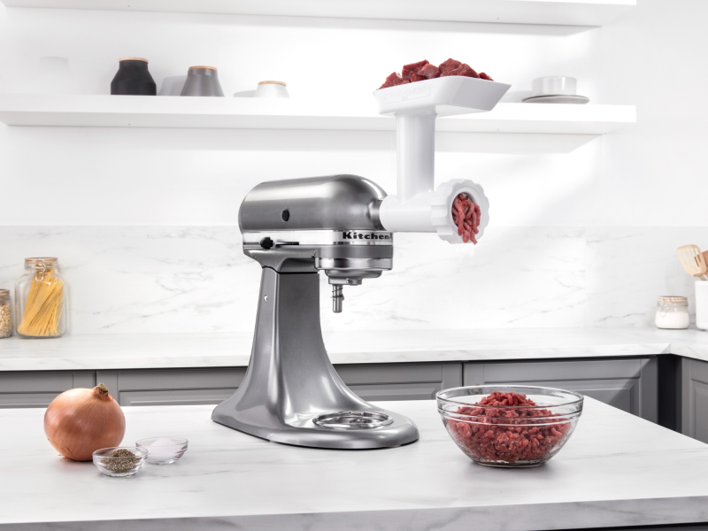 Silver KitchenAid® stand mixer with Meat Grinder Attachment grinding beef  Silver KitchenAid® stand mixer with Meat Grinder Attachment grinding beef