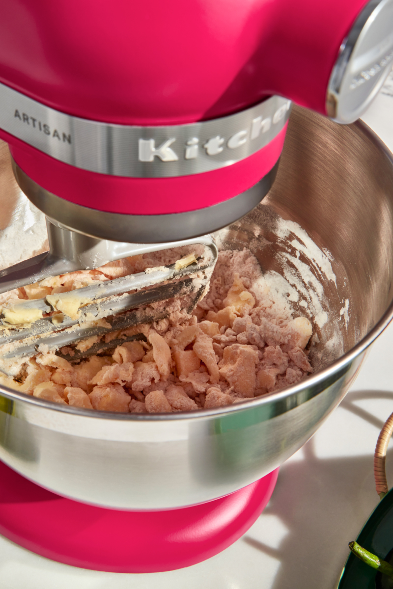A pink KitchenAid® stand mixer used to make dough