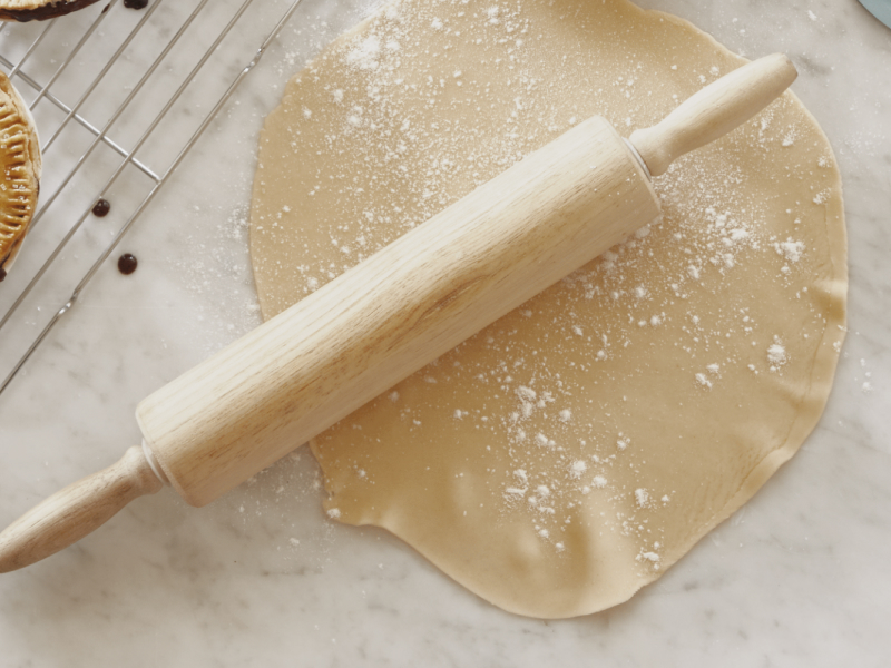 Rolled out dough and a rolling pin