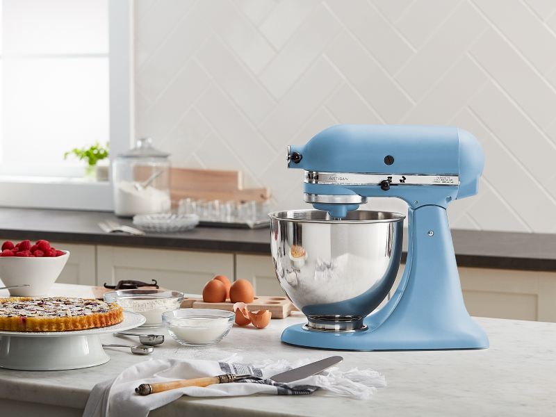 A light blue KitchenAid® stand mixer next to various ingredients A light blue KitchenAid® stand mixer next to various ingredients