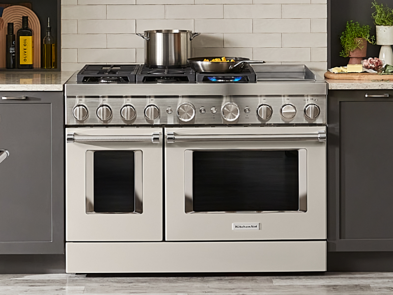 Dishes cooking on a large drop-in oven