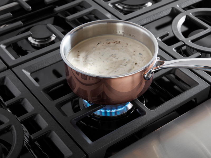 Rice pudding boiling on a burner