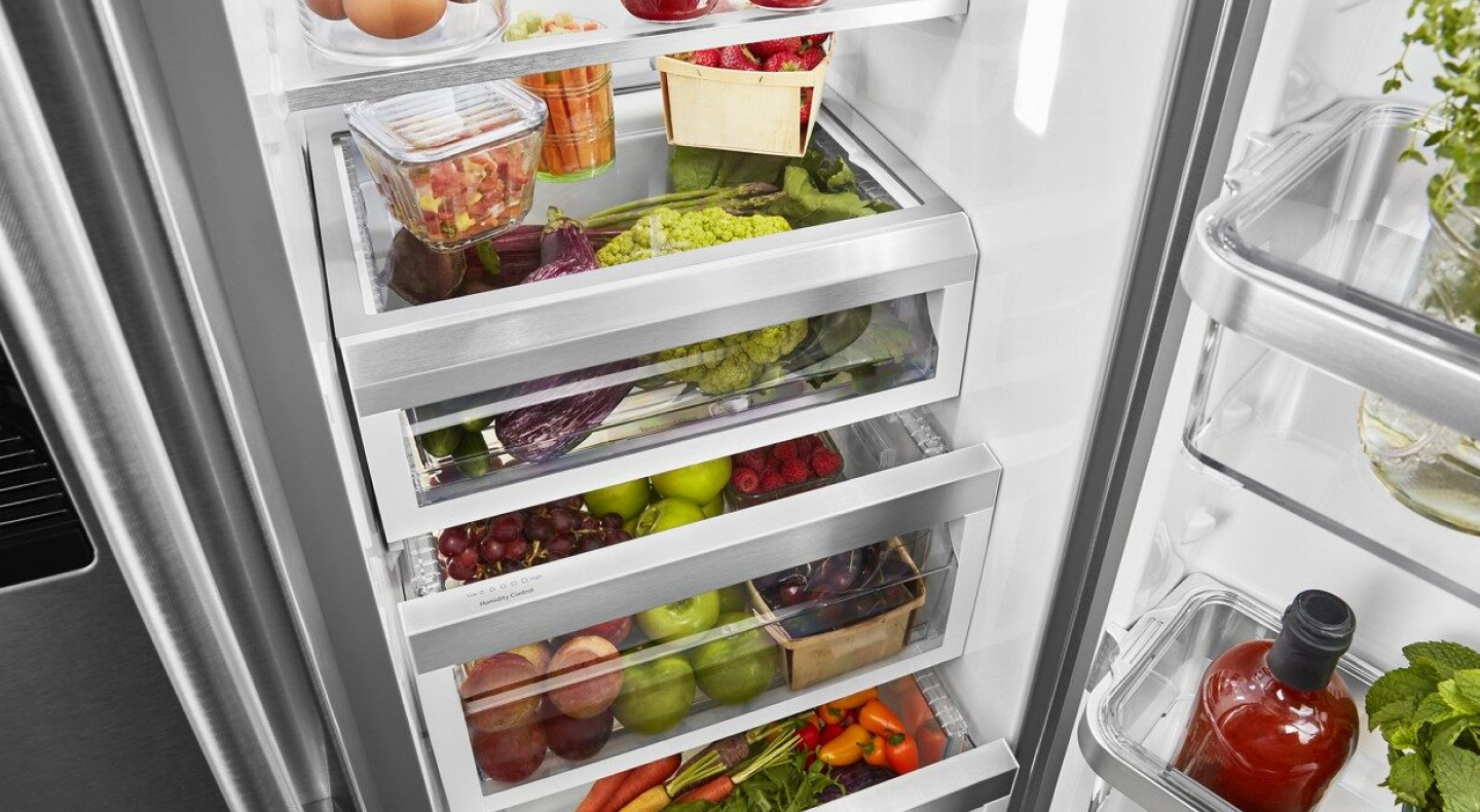 A refrigerator filled with salsa ingredients and other fresh foods A refrigerator filled with salsa ingredients and other fresh foods