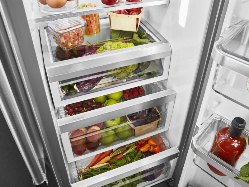 A refrigerator filled with salsa ingredients and other fresh foods A refrigerator filled with salsa ingredients and other fresh foods