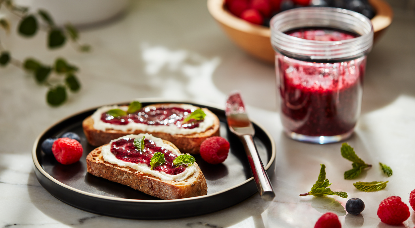 Slices of toast topped with fruit preserves and cheese Slices of toast topped with fruit preserves and cheese