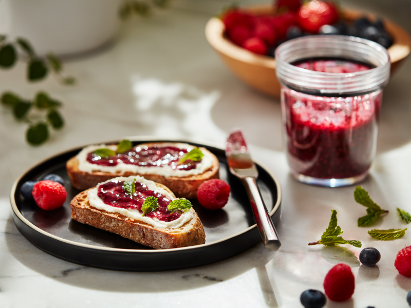 Slices of toast topped with fruit preserves and cheese Slices of toast topped with fruit preserves and cheese