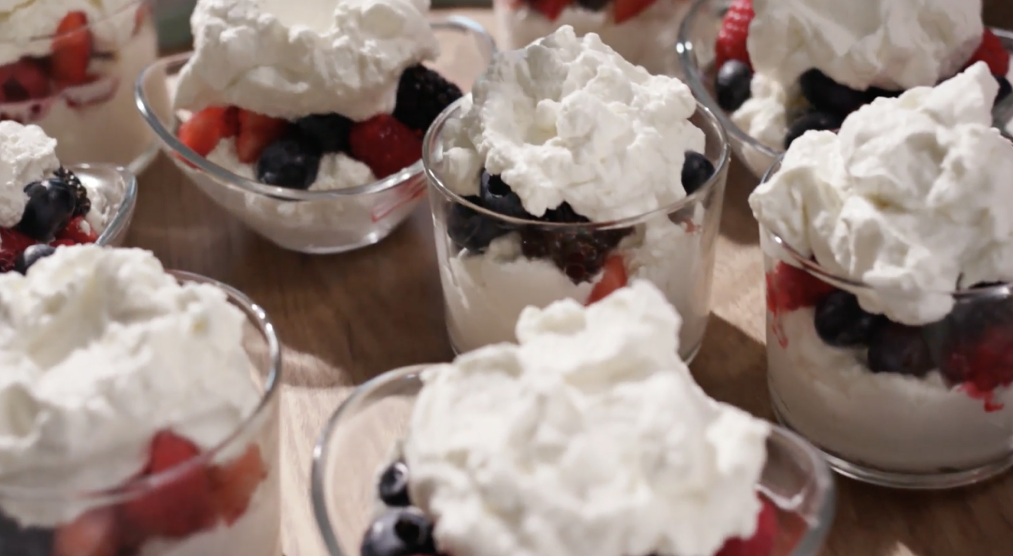 Fruit parfait topped with whipped cream Fruit parfait topped with whipped cream