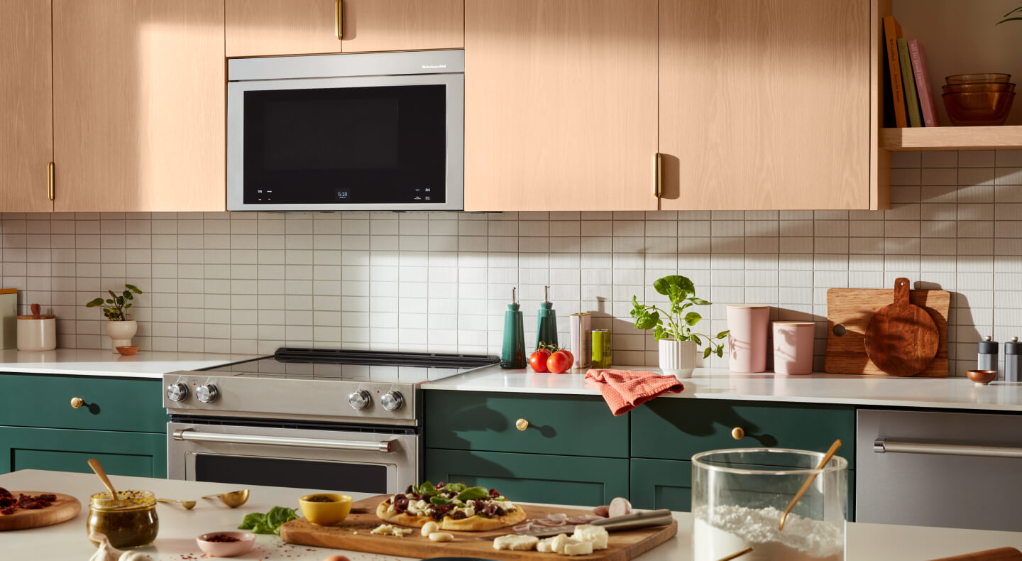 A bright kitchen with a KitchenAid® stove and over-the-range microwave