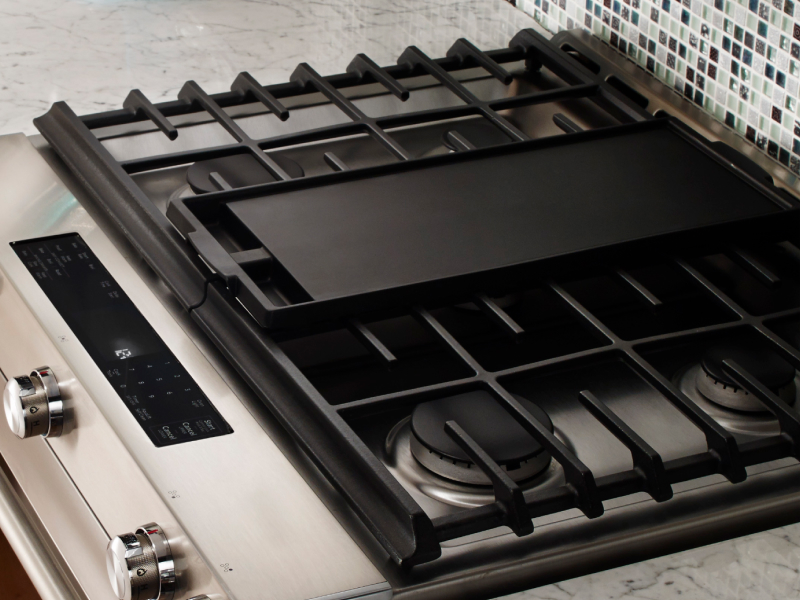 A griddle on a gas stove A griddle on a gas stove