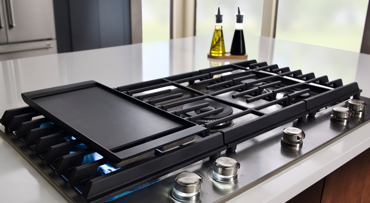 A griddle preheating on a gas stove A griddle preheating on a gas stove