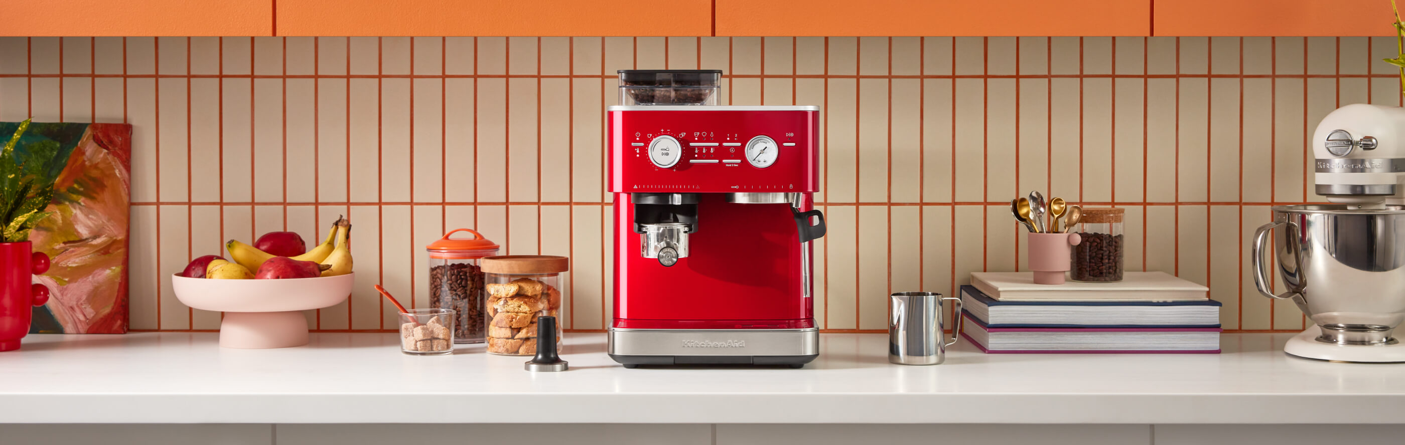 Red KitchenAid® semi-automatic espresso machine on a kitchen counter