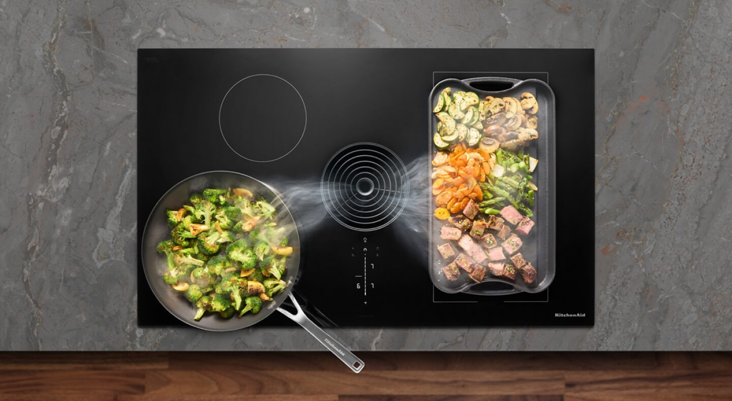 Food cooking on a KitchenAid® Induction Cooktop