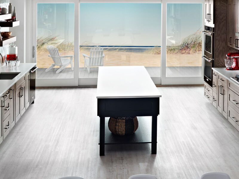 A large galley-shaped kitchen with an island A large galley-shaped kitchen with an island